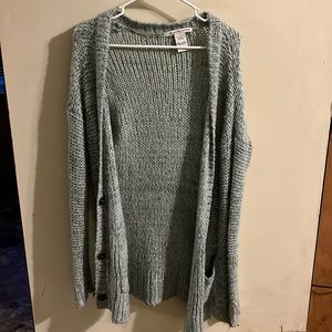 teal sweater with buttons and pockets